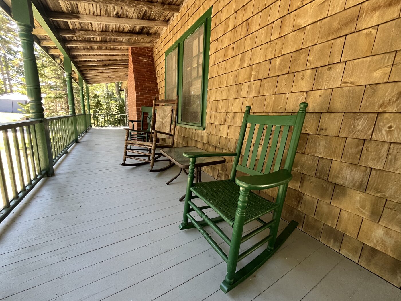 Rocking chairs on the wrap-around porch at Clubhouse Cottage