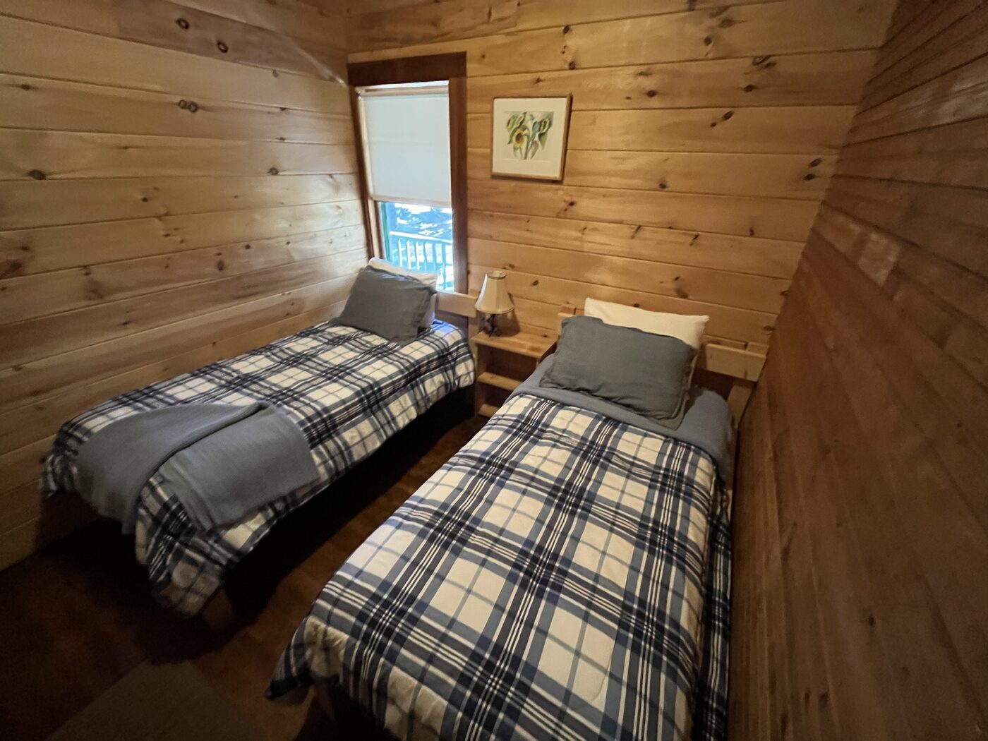 Twin bedroom with two beds inside Clubhouse Cottage