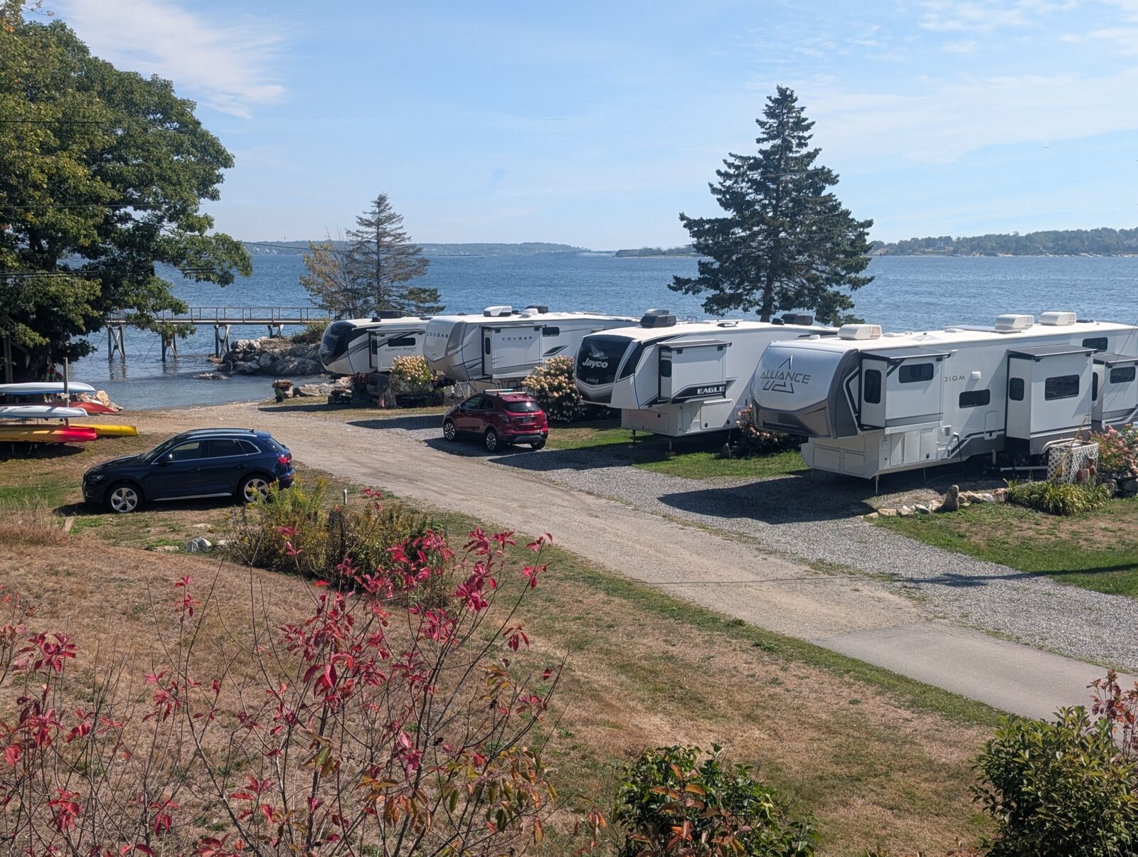 Row of RVs parked along the oceanfront at Gray Homestead