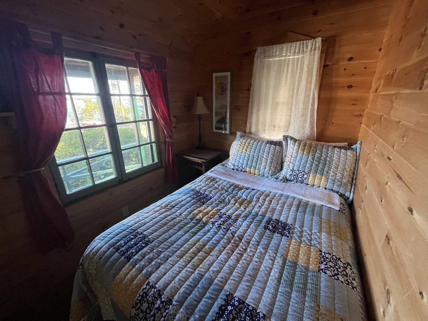 Bedroom with a water view inside Hillside Cottage