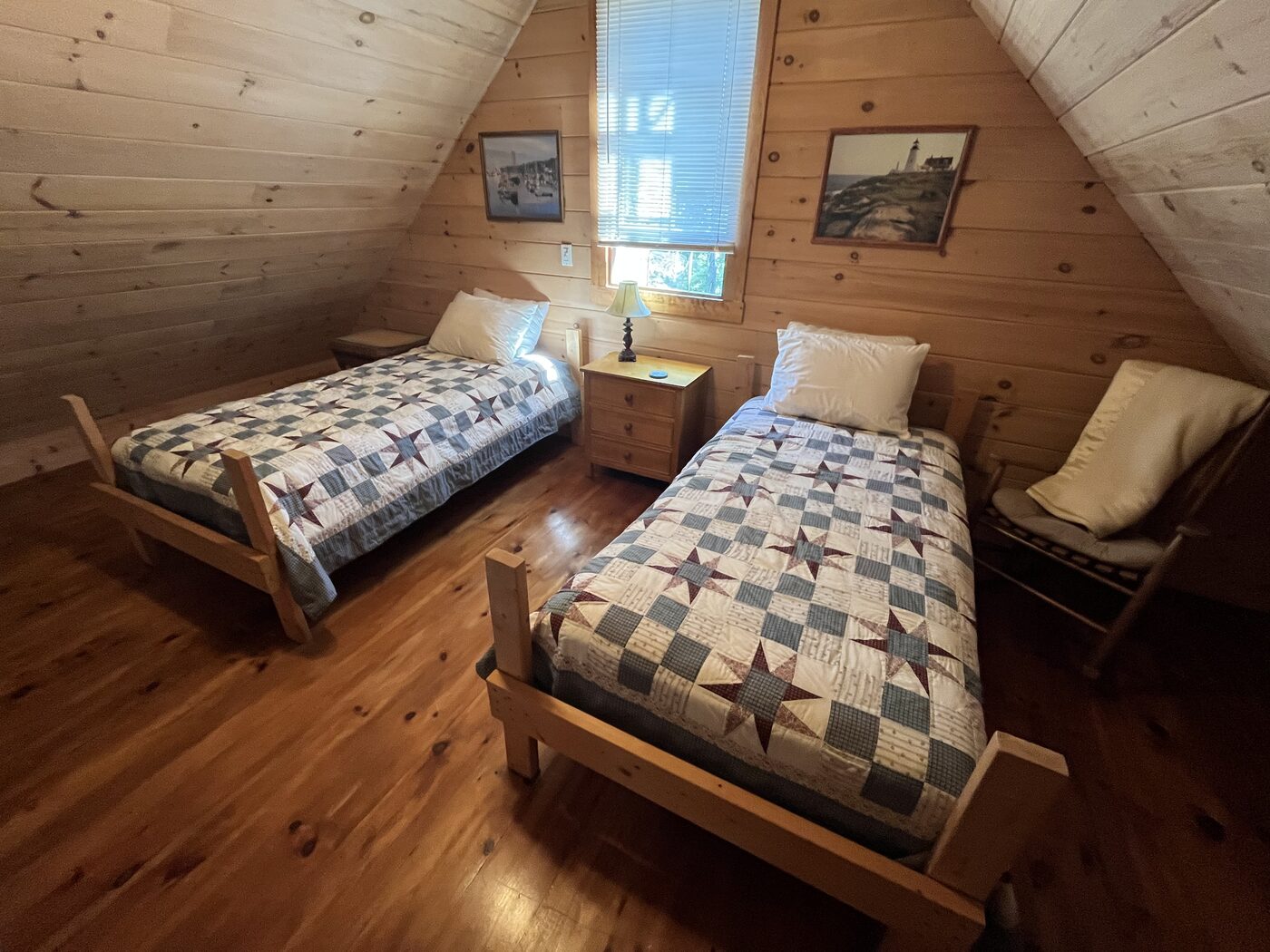 Twin bedroom with two beds inside Outer Heron Cottage