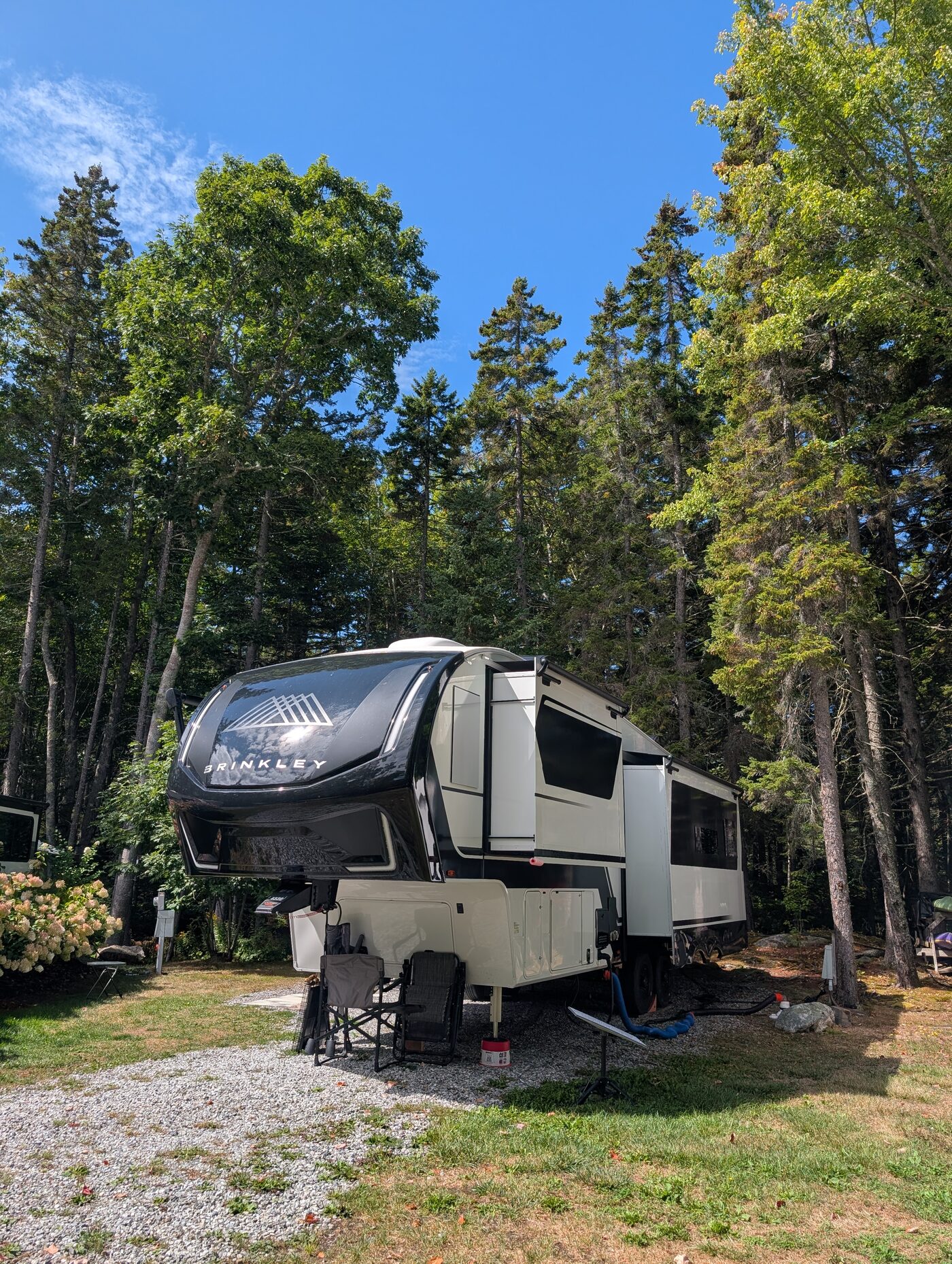 Fifth-wheel RV parked on Site 5 at Gray Homestead, available for weekly rental
